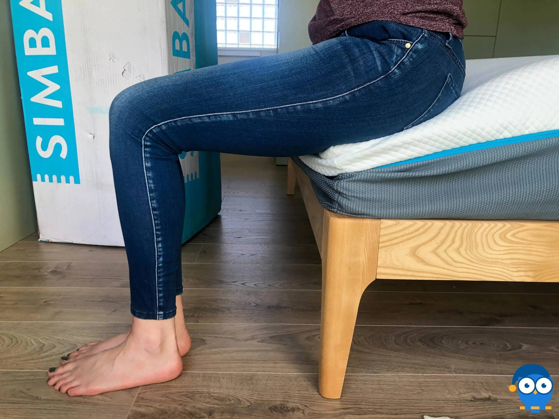 Person sitting on edge of Simba Hybrid Luxe